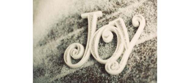 The word "Joy" on the ground with snow