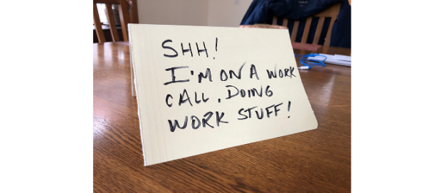 "Shh! I'm on a work call, doing work stuff!" note on a kitchen table