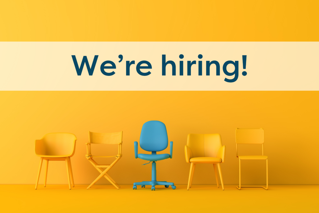 An image of yellow chairs with one blue one in the middle and the words "We're hiring!"