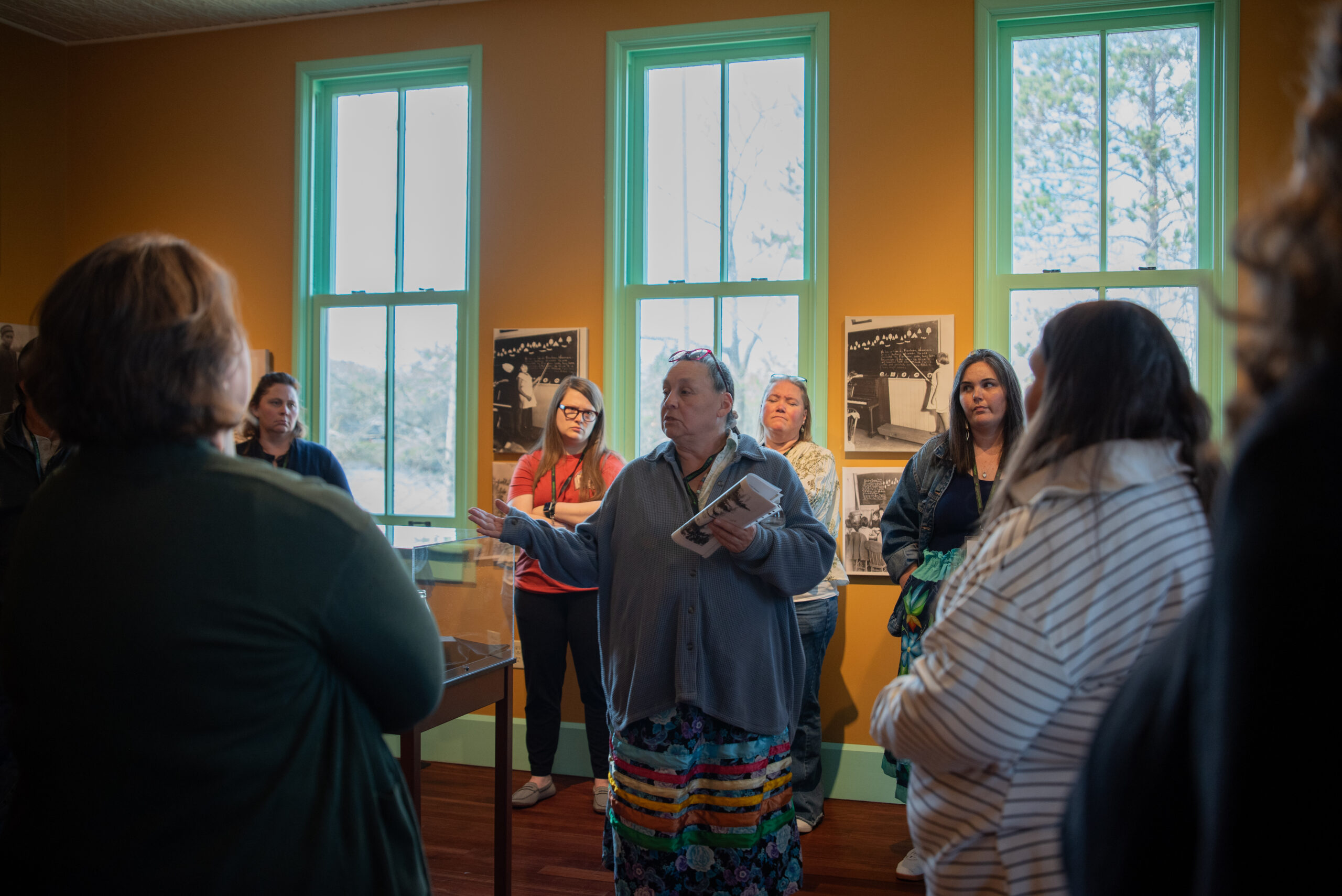 Teresa Mitchell leading a tour through the Government Boarding School Boys Dormitory
